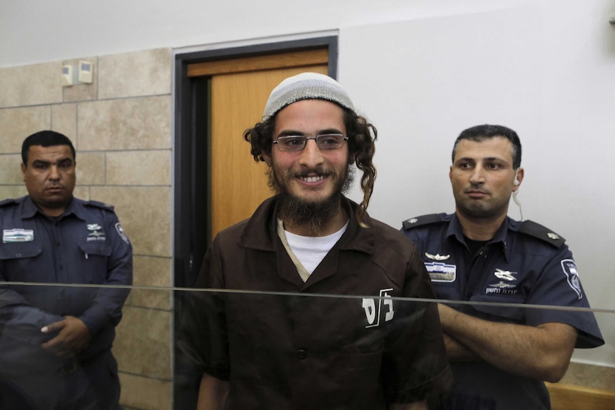 Meir Ettinger, the head of a Jewish extremist group and first person arrested, stands at the Israeli justice court in Nazareth, Israel.
