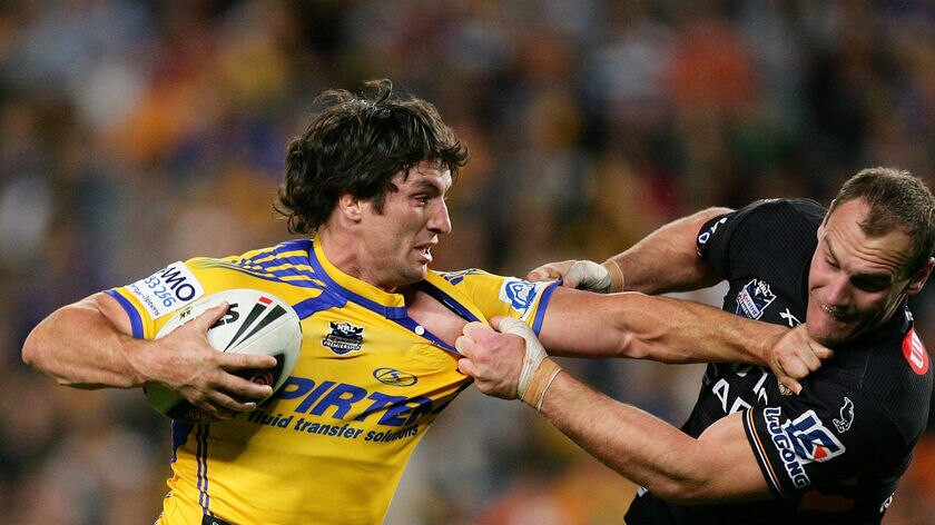 Don't argue: Nathan Hindmarsh puts a fend on Gareth Ellis in the Eels' sixth straight win.
