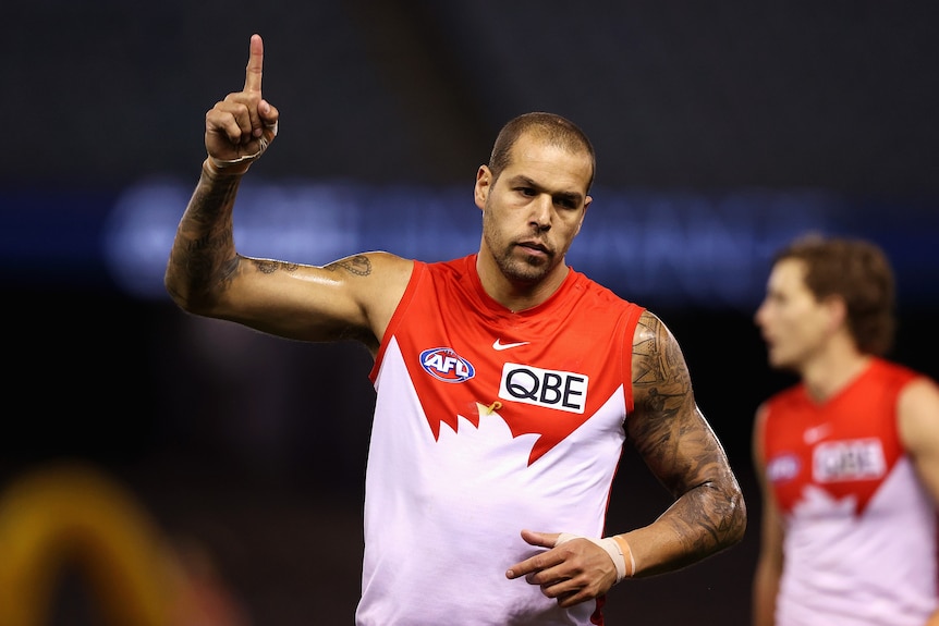 AFL player with hand in the arm celebrating after a goal