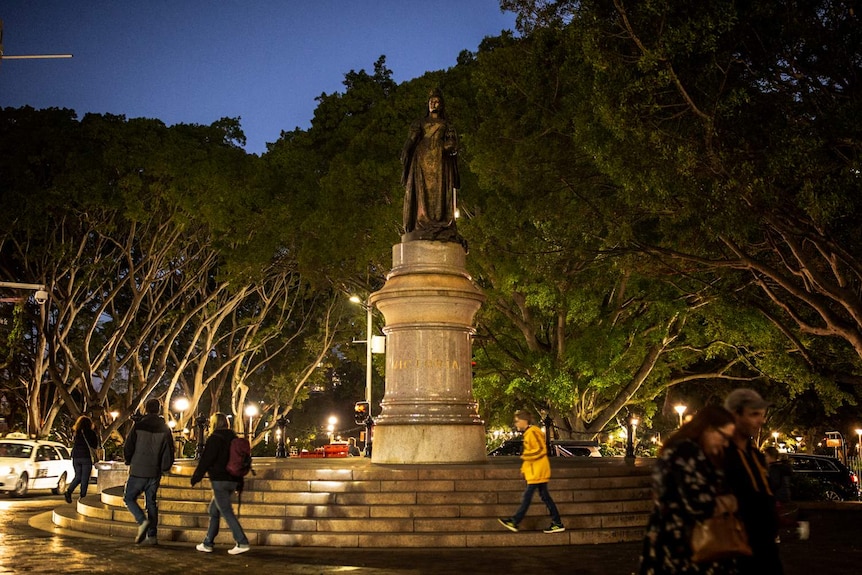 A statue of Queen Victoria on a marble column