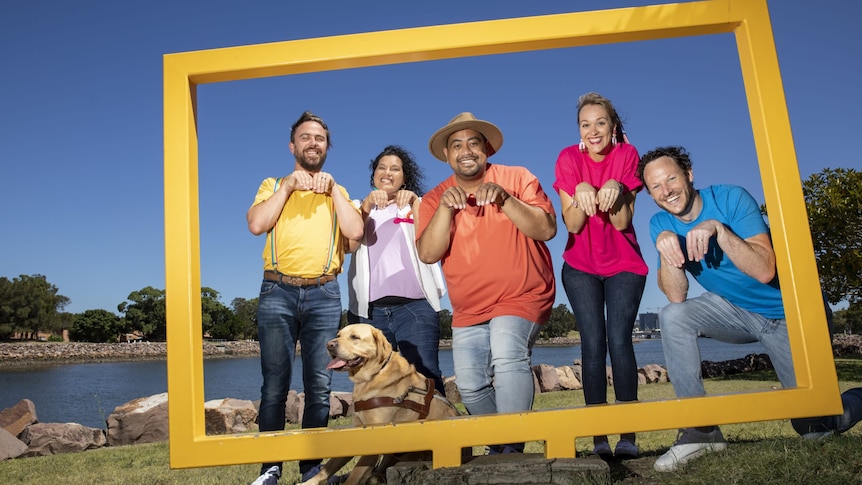 The five members of The Quokkas, a children's band, stand in a photo frame at a park.