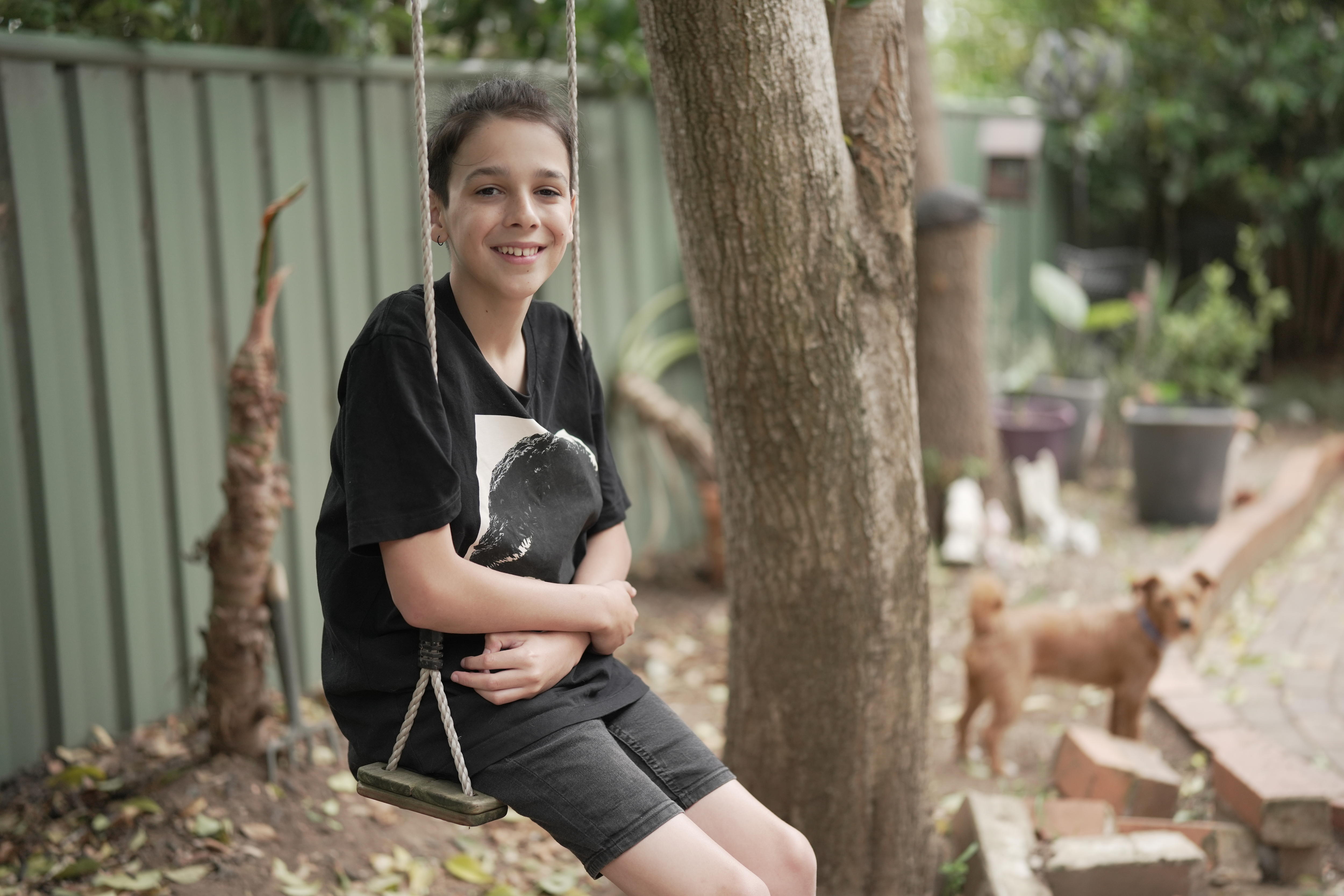 Proxy Alex sitting on swing