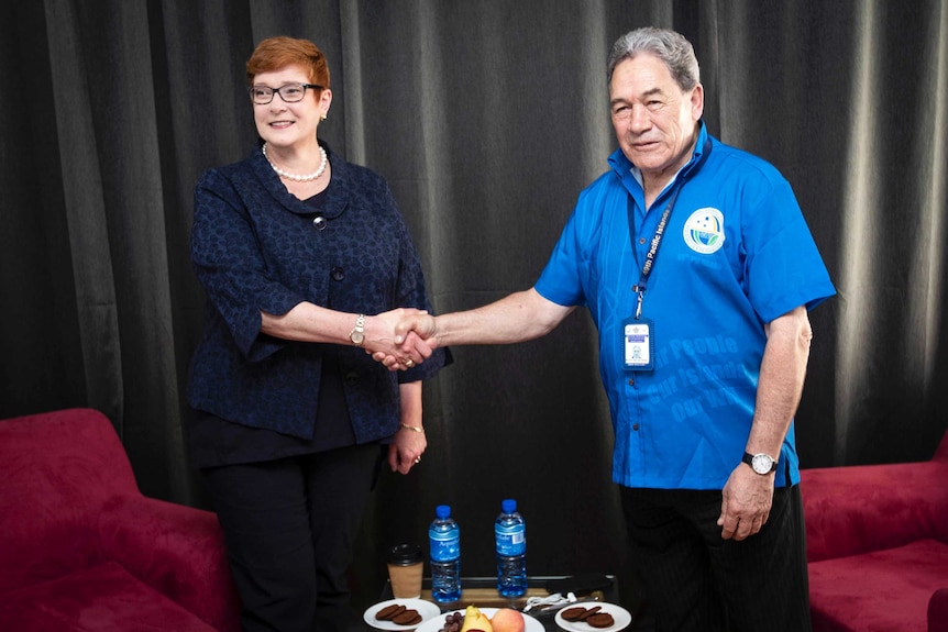 Marise Payne and Winston Peters shake hands before their meeting in Nauru for the Pacific Islands Forum.