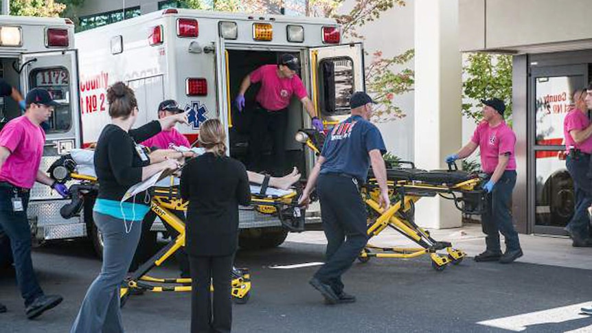 A patient is taken into a hospital emergency room after a shooting at Umpqua Community College in Oregon.