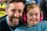 man and young daughter in Sydney FC blue colours