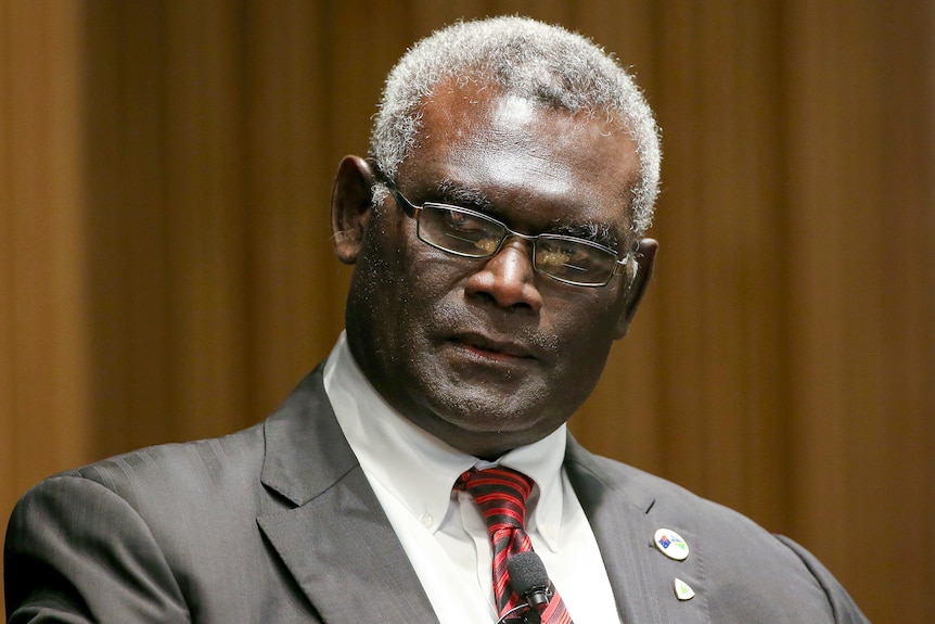 A close up of Manasseh Sogavare with a serious look on his face.  