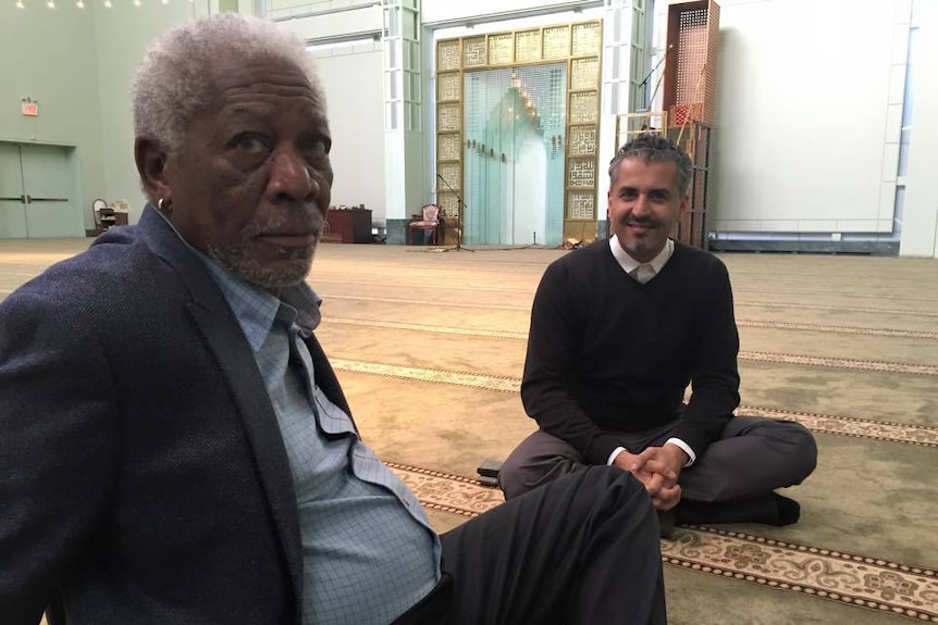 Maajid Nawaz speaks with actor Morgan Freeman at the Manhattan Islamic Centre in NYC.