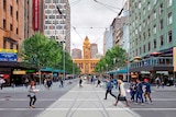 Artist rendering showing a tram terminus and pedestrian area next to single lane road in inner city.