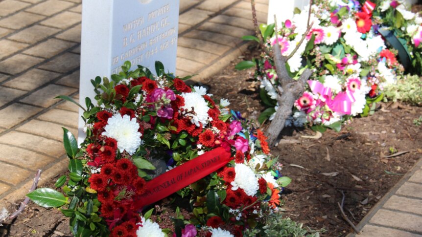 Flowers laid at Cowra War Cemetery