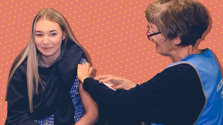 A young woman receives a vaccine from a nurse.