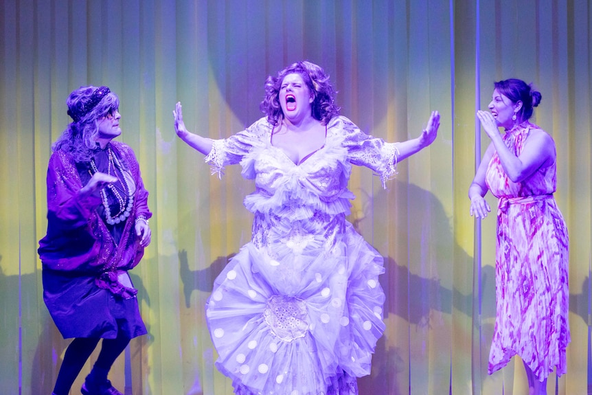 Brightly-lit stage shot of two women