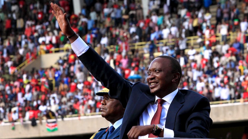 Uhuru Kenyatta waves after his swearing-in.
