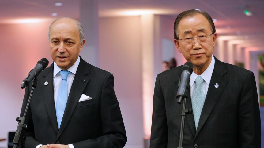 Laurent Fabius and Ban Ki-moon speak.