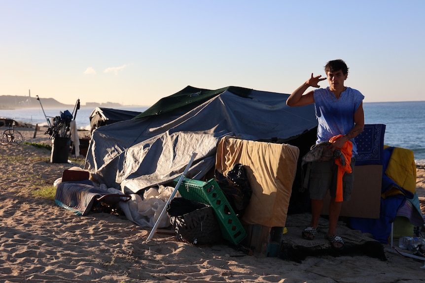 A man next to a tent.