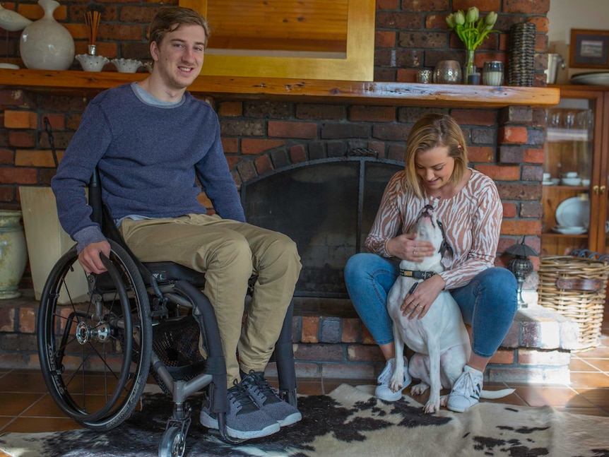 Jack Vawdrey in the living room with his sister Sam and dog MJ