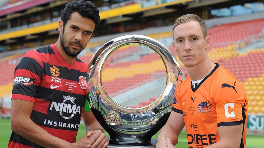 Nikolai Topor-Stanley of the Wanderers and Matt Smith of Roar with the trophy