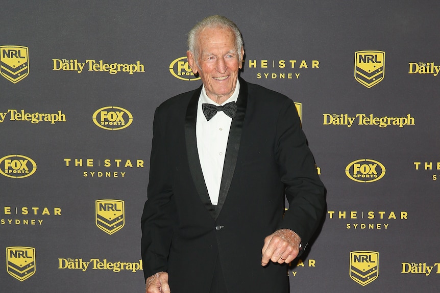 Norm Provan stands wearing a black tuxedo