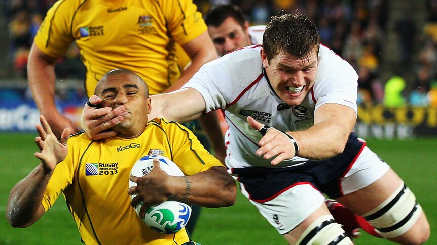 Collared ... stand-in Wallabies skipper Will Genia is tackled high by the Eagles' Hayden Smith.