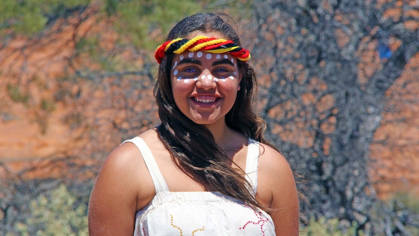 An Aboriginal woman in traditional garb