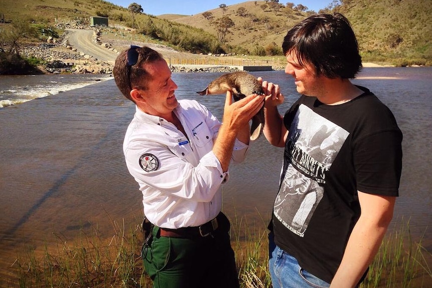 Brett McNamara and Cameron Blaseotto with platypus.