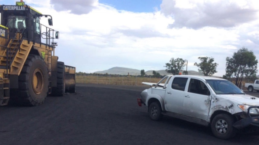 Light vehicle damaged after collision with front-end loader