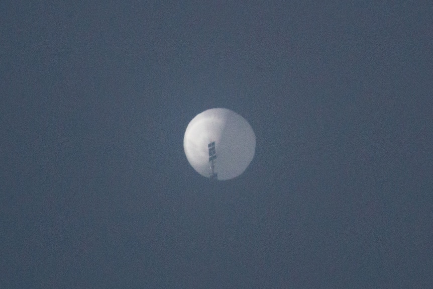 A white spherical object can be seen in a blue skey over Billings, Montana