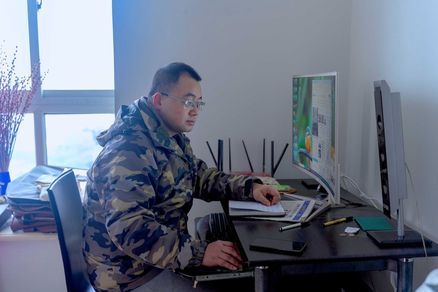 A man using computer at home