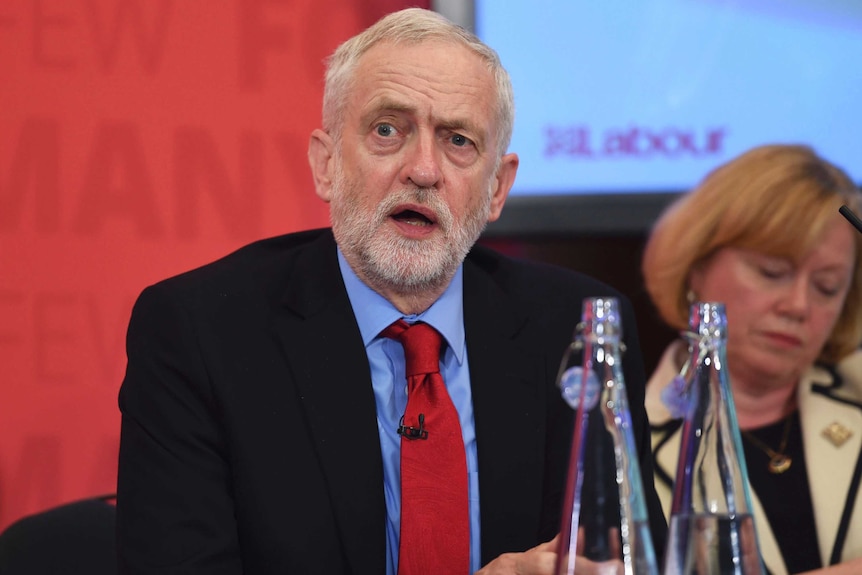 Jeremy Corbyn looks on during a campaign event