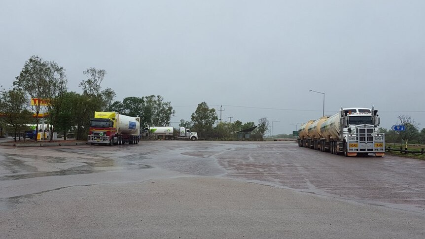 Road trains from Queensland stuck at the Three Ways roadhouse.