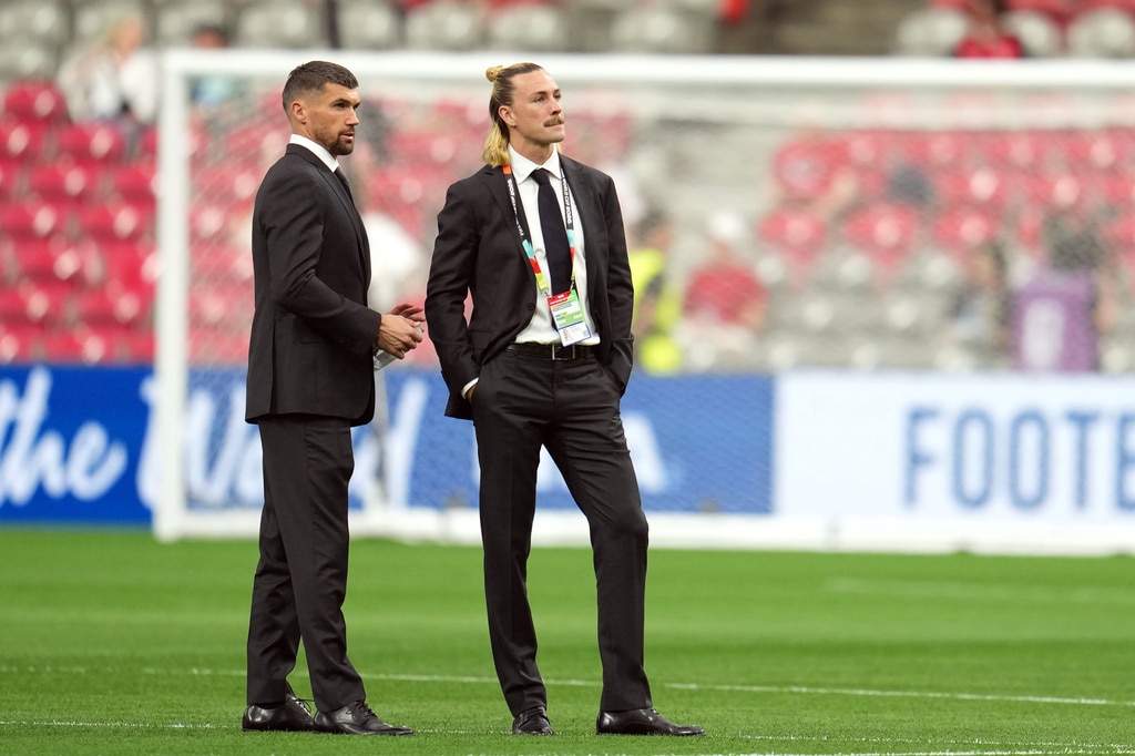 Mat Ryan and Jackson Irvine wear suits