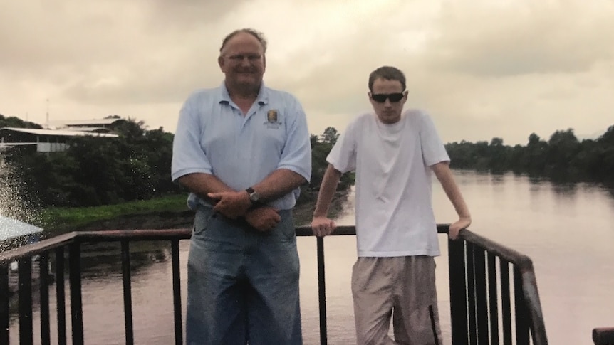 Bill and Jozef Stefaniak pose for a picture on a bridge.