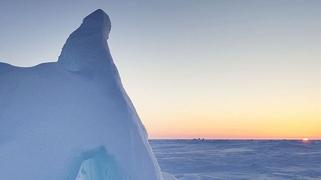 The sun sets over Arctic ice