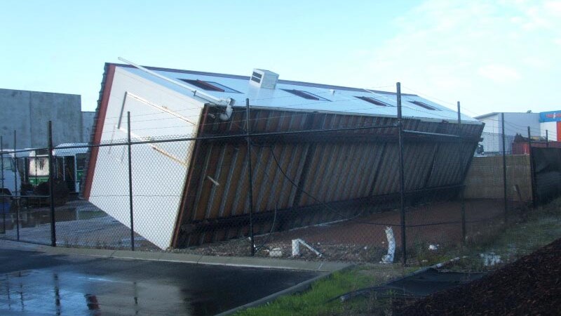 Storm blows over site office in Dunsborough, south of Perth.
