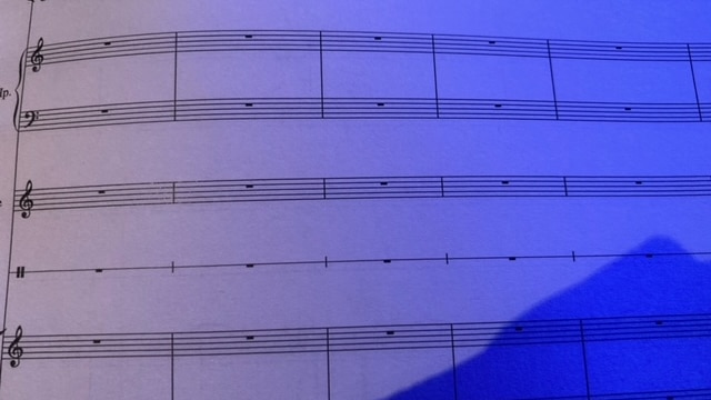A page of blank staves, where a didgeridoo player will improvise notes.