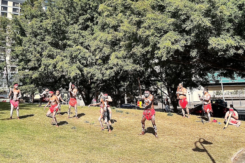 Indigenous dancers perform at Brisbane's Come Together For Yes rally in the Roma Street Parklands