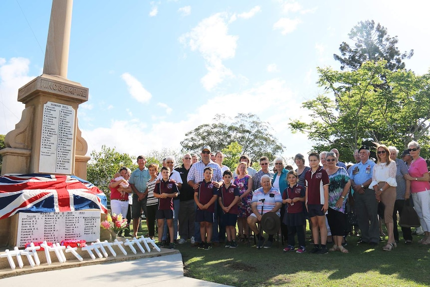 People from the town of Maroon in Queensland's Scenic Rim region gather around the memorial of the 17 men lost in World War I.