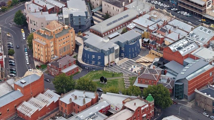 a birds eye view of the city campus, showing buildings and a central green space.