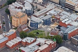 a birds eye view of the city campus, showing buildings and a central green space.