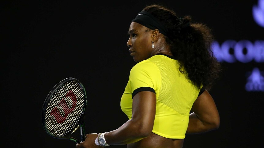 Serena Willams holding a racket after a point