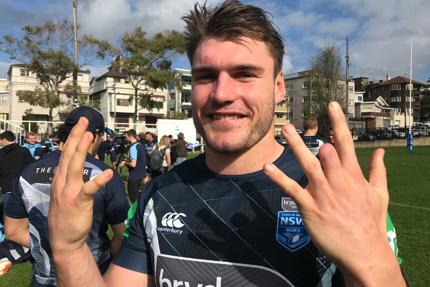 South Sydney rugby league player Angus Crichton shows off his amputated finger.
