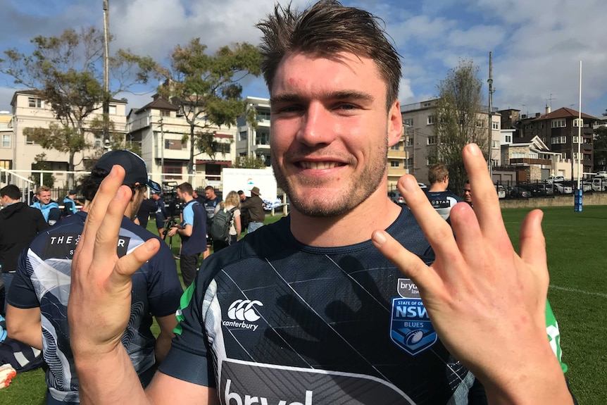 South Sydney rugby league player Angus Crichton shows off his amputated finger.