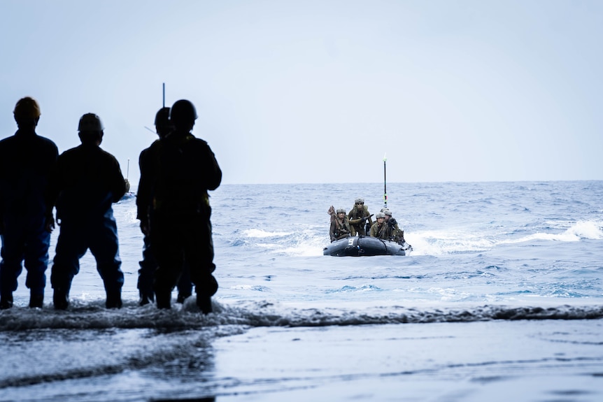 ARDB soldiers train on an inflatable boat.