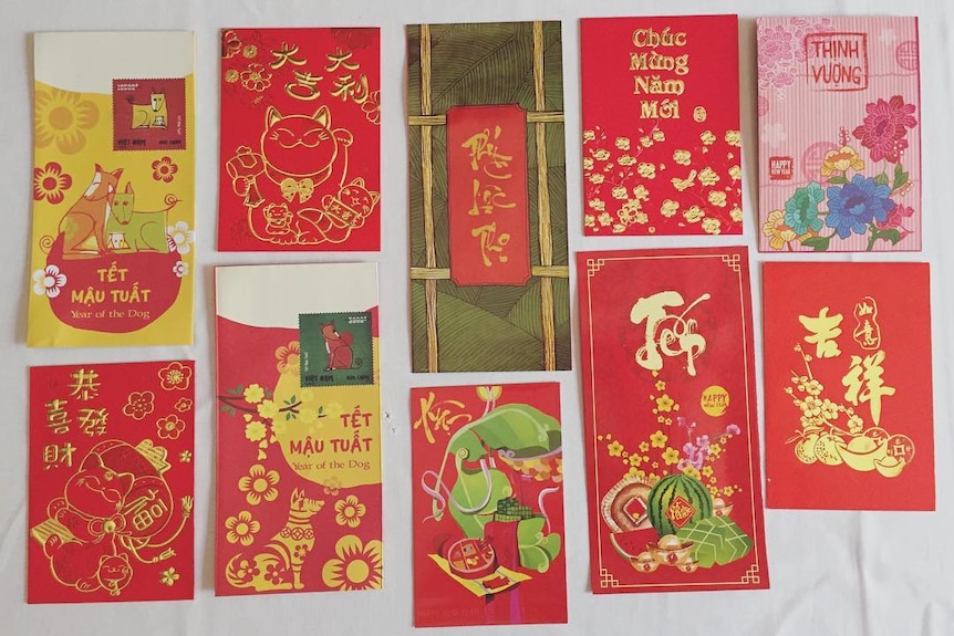 Ten different red packets with various Year of the Dog designs.
