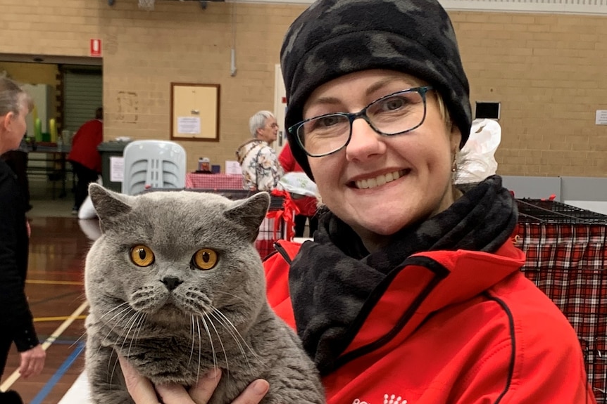Pamela Lanigan holding her adult British shorthair cat 