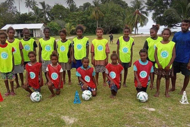 Boromole primary school girls and soccer coach (Angela Muni)