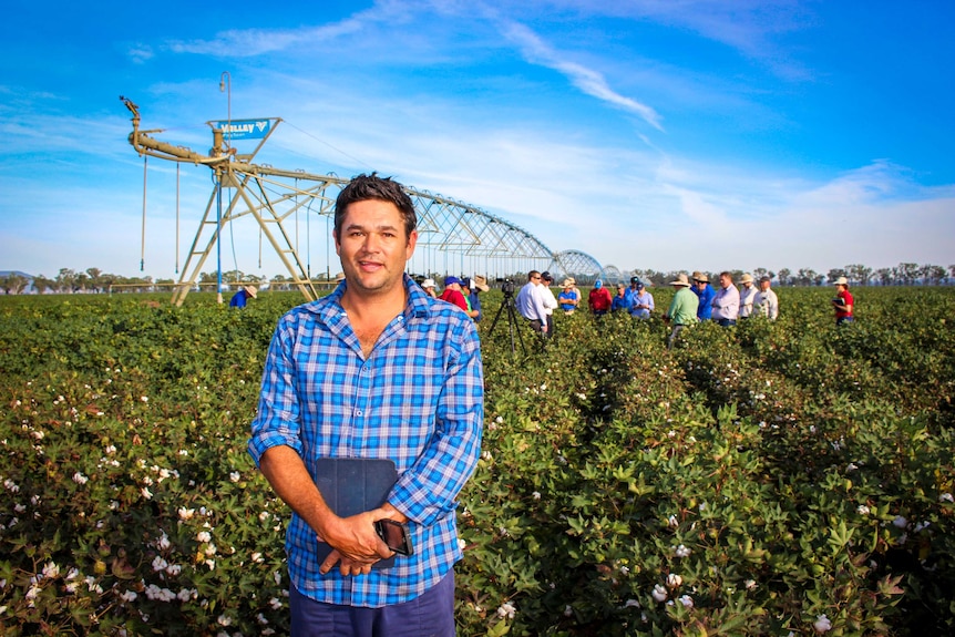 James Barlow standing in cotton field.