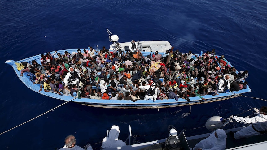 African migrants on boat off Sicily's coast