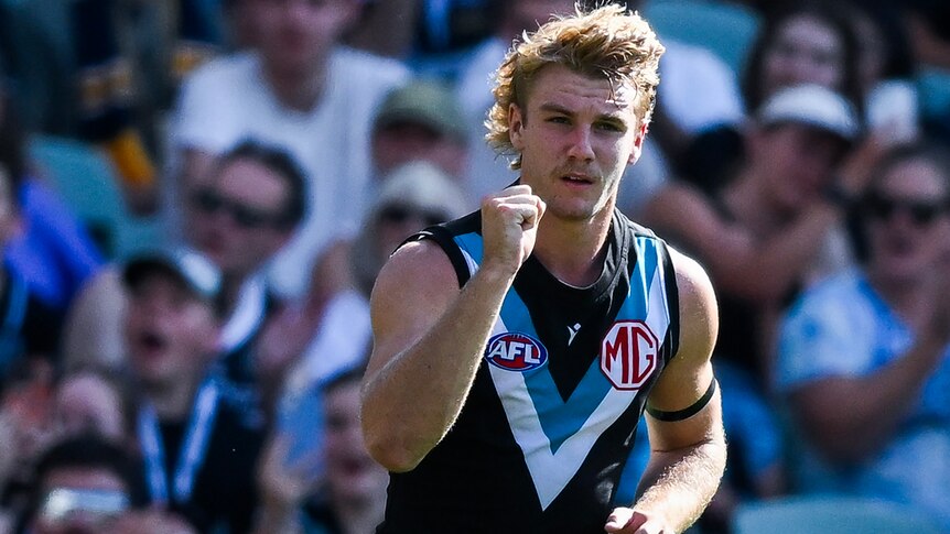 Jason Horne-Francis pumps his right fist during an AFL match.