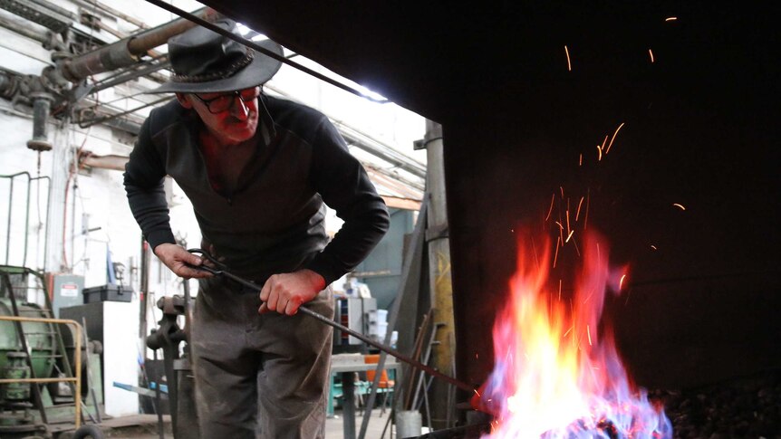 a man working as a blacksmith