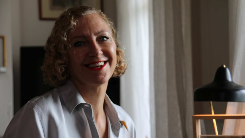 Playwright Joanna Murray-Smith smiles in her Melbourne study.